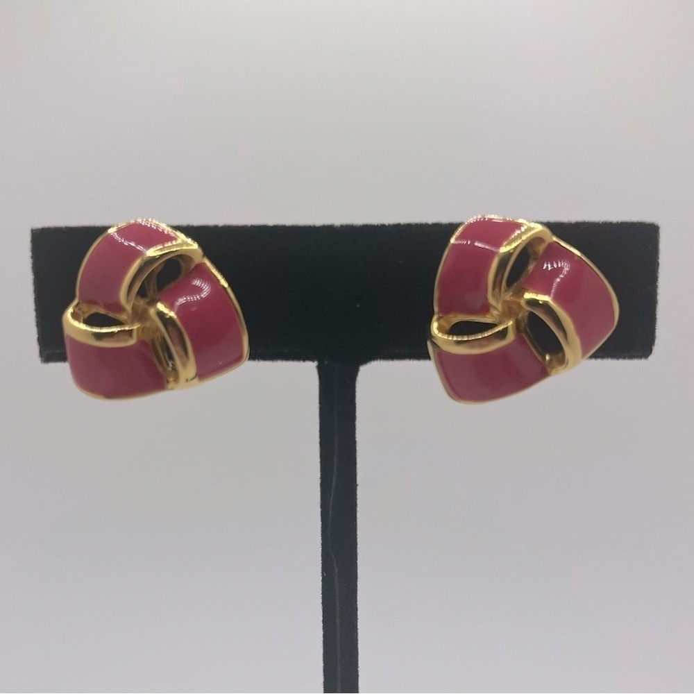 Vintage, gold tone and pink enamel clip on earrings with screws. Signed JS